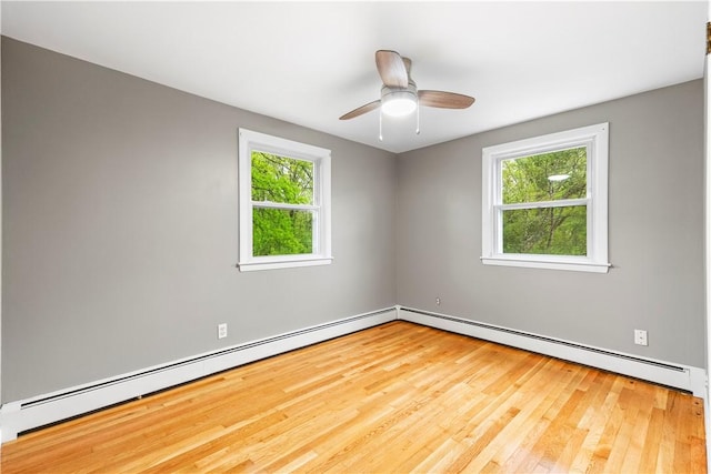 3 Baylor Dr, Coventry, RI 02816 - empty room with plenty of natural light, wood finished floors, baseboard heating, and a ceiling fan