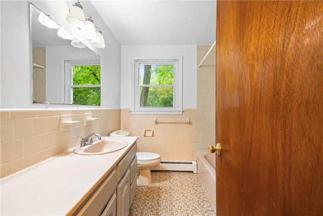 3 Baylor Dr, Coventry, RI 02816 - bathroom featuring a baseboard heating unit, toilet, vanity, tile walls, and a wainscoted wall