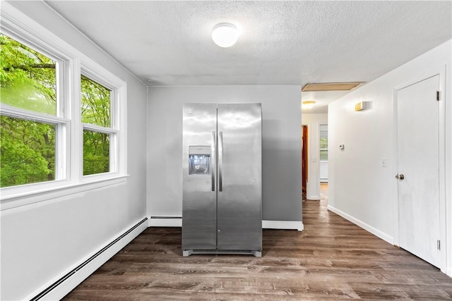 3 Baylor Dr, Coventry, RI 02816 - spare room featuring baseboard heating, a textured ceiling, wood finished floors, and baseboards