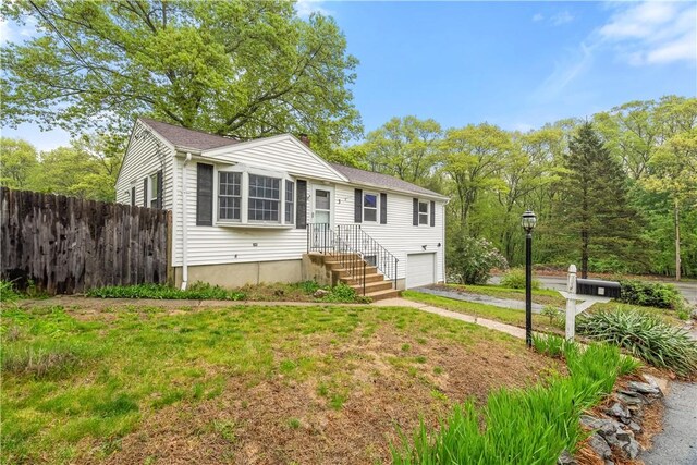 3 Baylor Dr, Coventry, RI 02816 - view of front of property with fence, asphalt driveway, and a garage