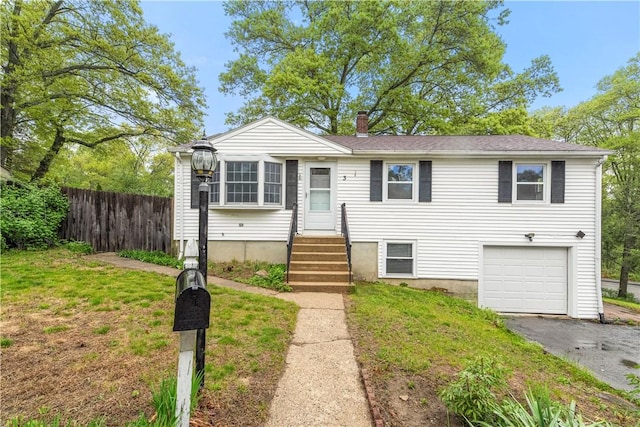 3 Baylor Dr, Coventry, RI 02816 - view of front of property with fence, a garage, a chimney, and driveway