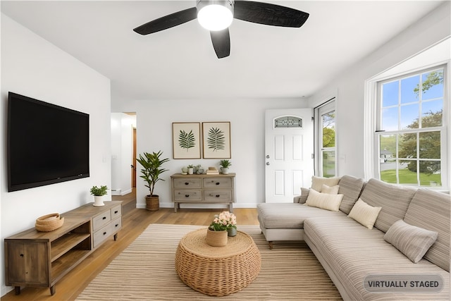 3 Baylor Dr, Coventry, RI 02816 - living room with healthy amount of natural light, light wood-style flooring, a ceiling fan, and baseboards