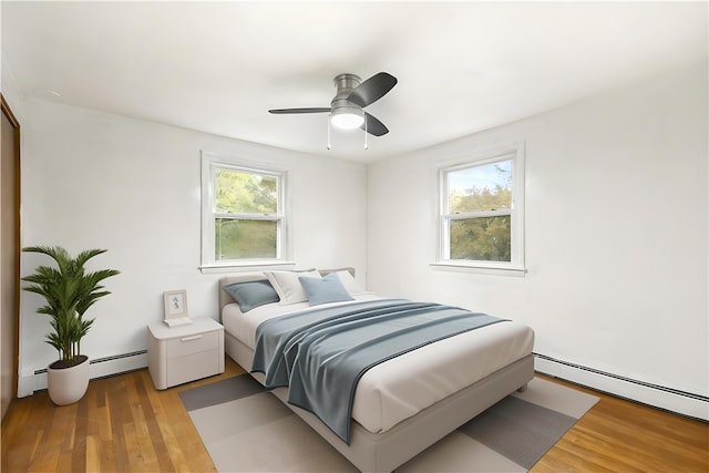 3 Baylor Dr, Coventry, RI 02816 - bedroom with multiple windows, a baseboard radiator, and wood finished floors