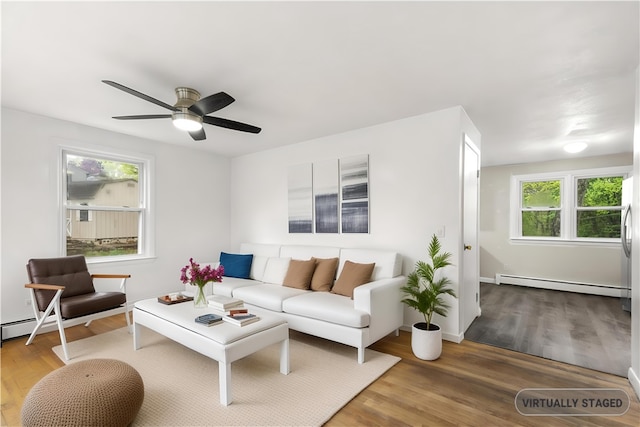 3 Baylor Dr, Coventry, RI 02816 - living area with baseboard heating, wood finished floors, and ceiling fan