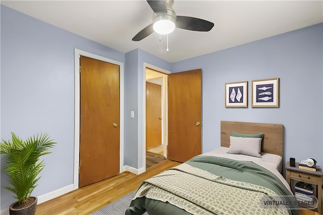 3 Baylor Dr, Coventry, RI 02816 - bedroom with light wood finished floors, baseboards, ceiling fan, and a closet