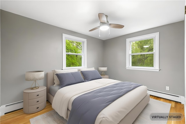 3 Baylor Dr, Coventry, RI 02816 - bedroom with a baseboard radiator, multiple windows, and wood finished floors