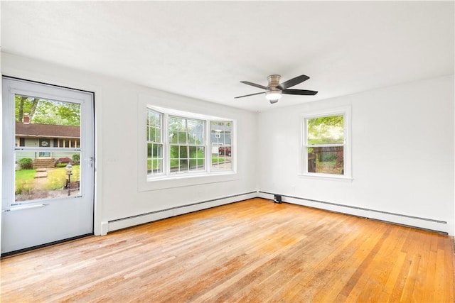 3 Baylor Dr, Coventry, RI 02816 - spare room featuring plenty of natural light, wood finished floors, a baseboard heating unit, and ceiling fan