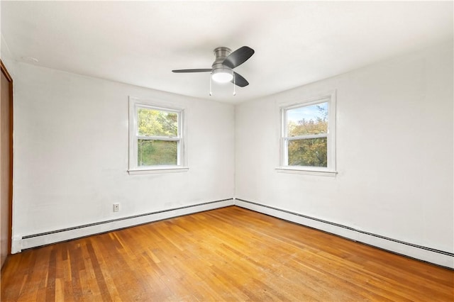 3 Baylor Dr, Coventry, RI 02816 - empty room featuring wood finished floors, baseboard heating, and a ceiling fan