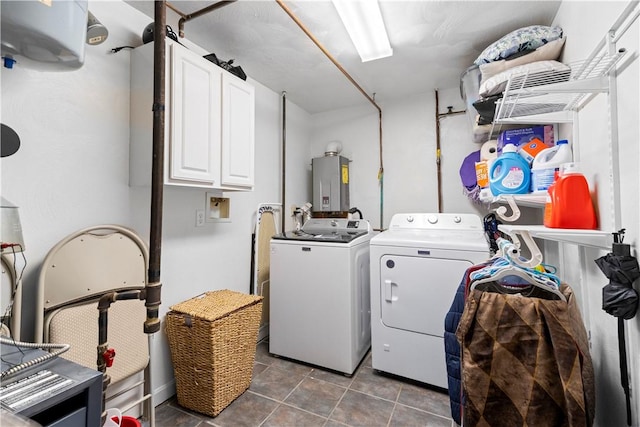 washroom featuring cabinet space, separate washer and dryer, water heater, and tile patterned flooring