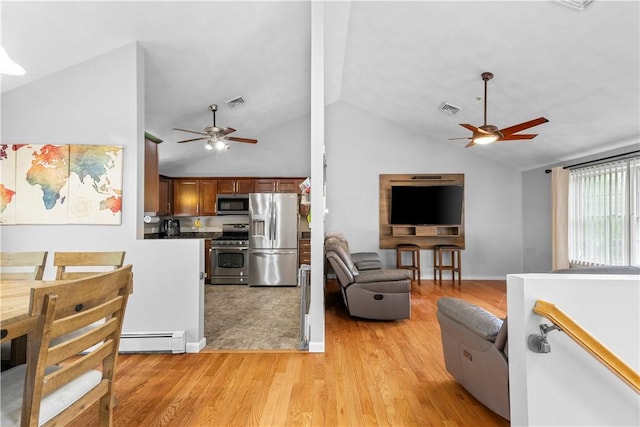 living area with ceiling fan, baseboard heating, vaulted ceiling, and light wood-style floors