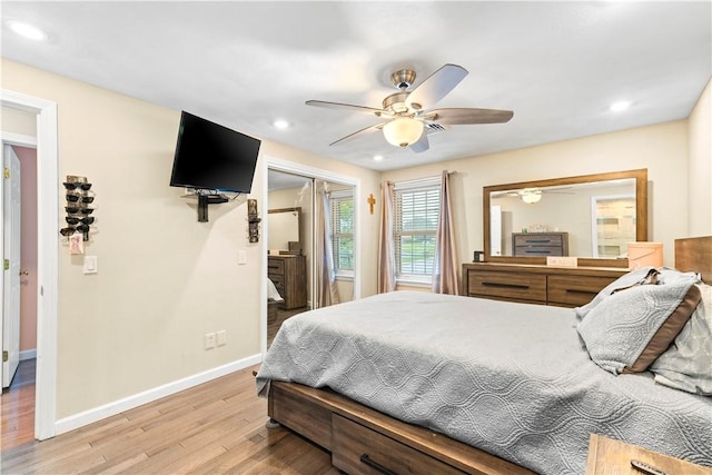 bedroom featuring light wood finished floors, baseboards, recessed lighting, ceiling fan, and a closet