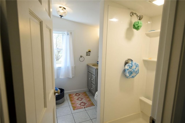full bath with tile patterned floors, vanity, a shower, and baseboards