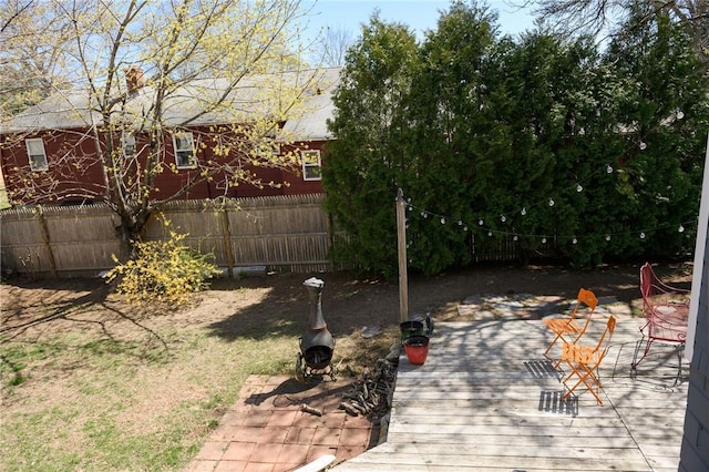 fenced backyard with a wooden deck