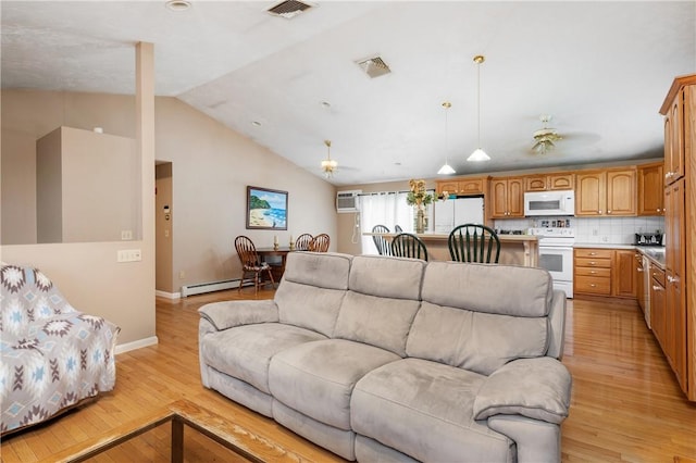 living area with light wood-style flooring, vaulted ceiling, baseboards, a baseboard radiator, and a wall mounted air conditioner