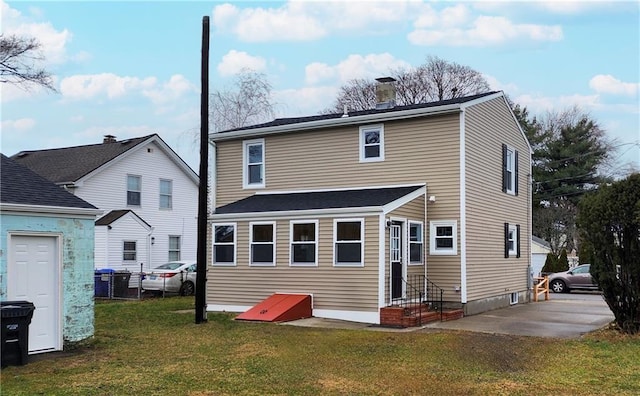 11 Crane St S, Pawtucket, RI 02860 - back of house featuring a yard and a chimney