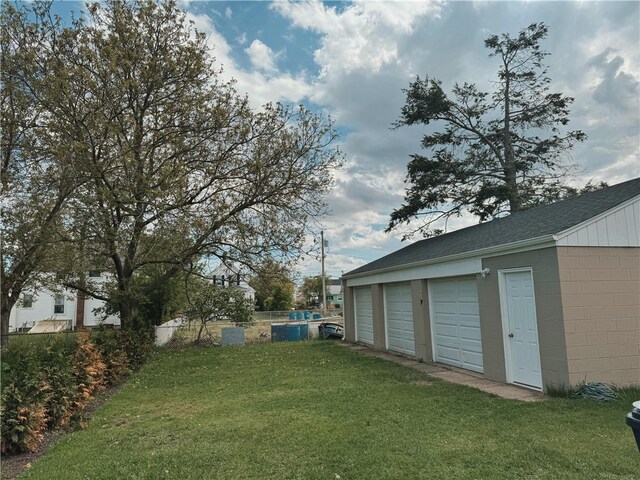 11 Crane St S, Pawtucket, RI 02860 - view of grassy yard featuring a garage and an outdoor structure