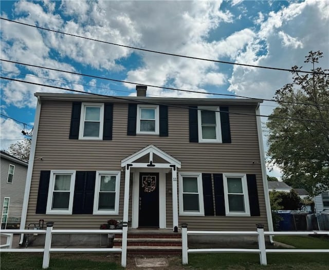 11 Crane St S, Pawtucket, RI 02860 - view of front of house with fence and a chimney