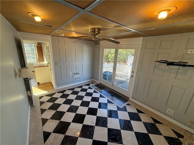 entrance foyer with tile patterned floors and ceiling fan