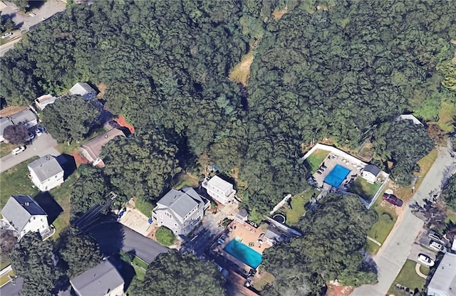 view of property location with a pool