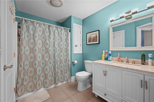 bathroom featuring toilet, vanity, tile patterned floors, and a shower with curtain