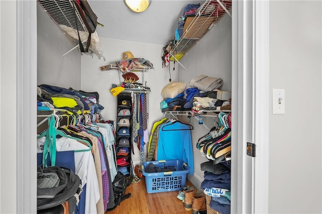 spacious closet featuring wood finished floors
