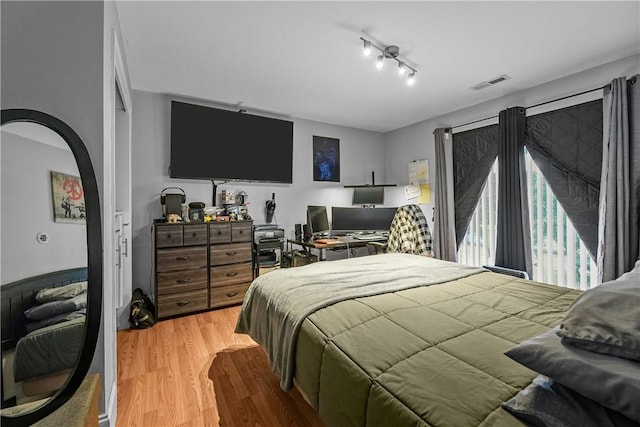 bedroom with light wood finished floors