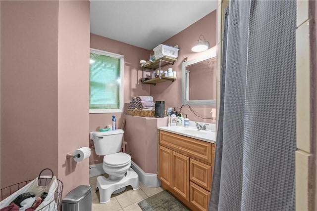 bathroom featuring tile patterned floors, toilet, vanity, and a shower with shower curtain