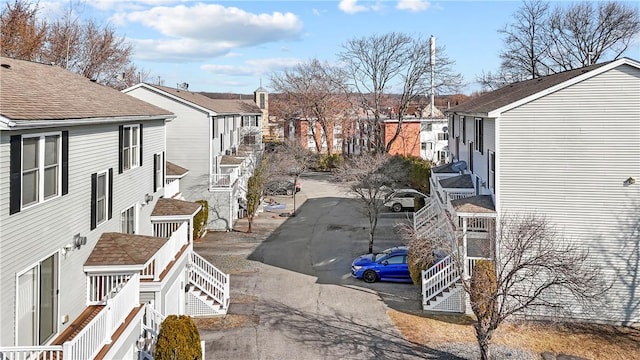 view of yard with stairs and a residential view