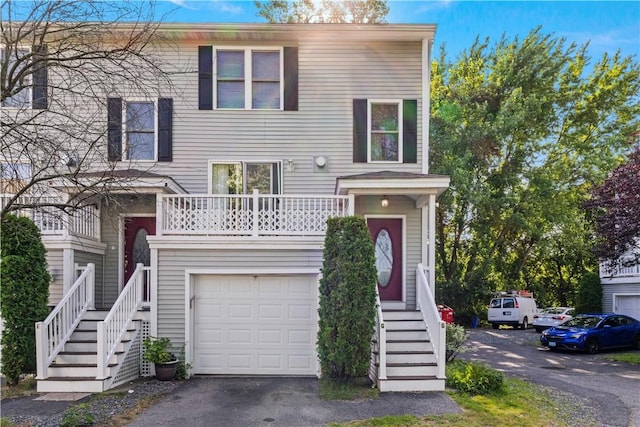 5 Morrill Ln Unit G, North Providence, RI 02904 - raised ranch featuring an attached garage, stairs, and asphalt driveway