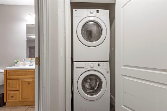 5 Morrill Ln Unit G, North Providence, RI 02904 - washroom with estacked washer and dryer and light tile patterned floors