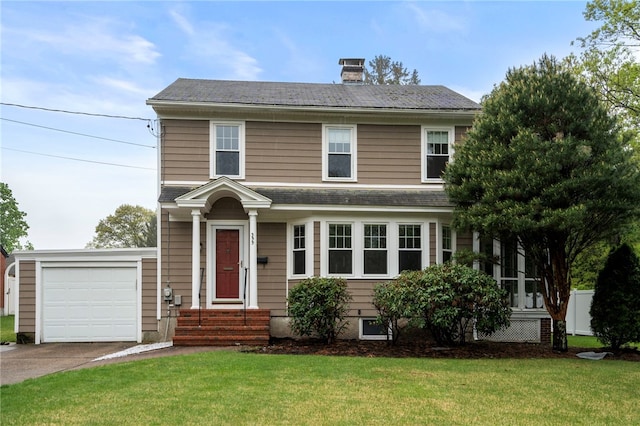 view of front of property with a front yard, driveway, a chimney, roof with shingles, and an attached garage