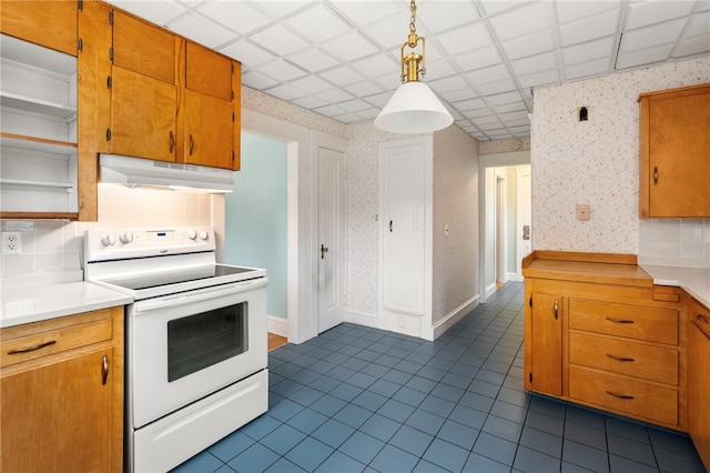 kitchen with white range with electric stovetop, under cabinet range hood, wallpapered walls, light countertops, and decorative backsplash