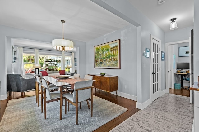 224 Gibbs Ave, Newport, RI 02840 - dining space with wood finished floors, baseboards, a chandelier, and french doors