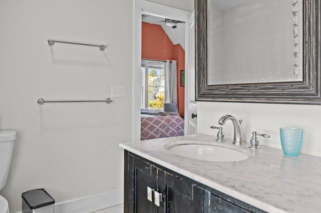 224 Gibbs Ave, Newport, RI 02840 - bathroom featuring vanity, toilet, lofted ceiling, and tile patterned flooring