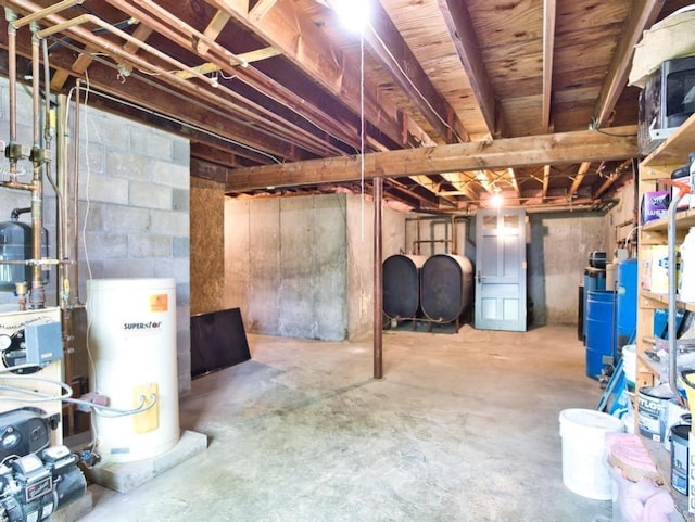 58 Leonard Dr, Tiverton, RI 02878 - unfinished basement with gas water heater, oil tank, a heating unit, and a water pressure tank