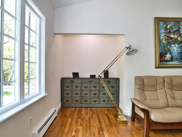 58 Leonard Dr, Tiverton, RI 02878 - sitting room with a baseboard radiator, wood finished floors, and baseboards