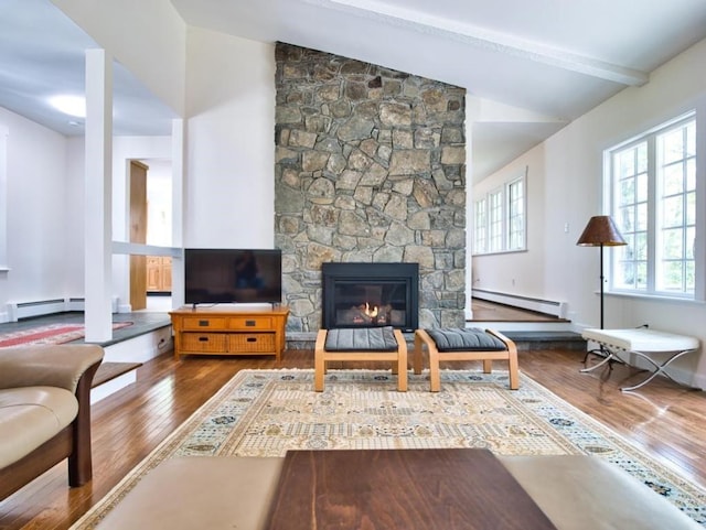58 Leonard Dr, Tiverton, RI 02878 - living area with baseboard heating, wood finished floors, a stone fireplace, beam ceiling, and high vaulted ceiling