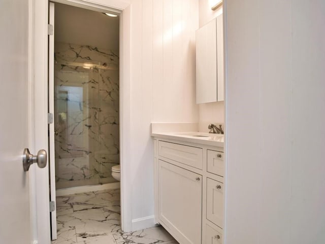 58 Leonard Dr, Tiverton, RI 02878 - bathroom with marble look tile flooring, a marble finish shower, vanity, toilet, and baseboards