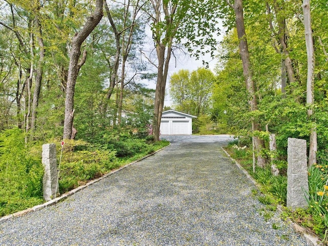 58 Leonard Dr, Tiverton, RI 02878 - view of front facade with an outdoor structure and a garage