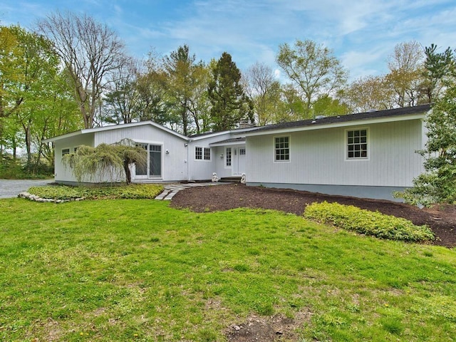 58 Leonard Dr, Tiverton, RI 02878 - rear view of house featuring a yard
