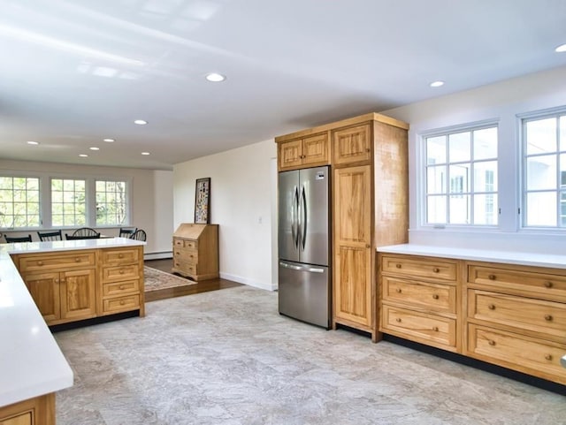 58 Leonard Dr, Tiverton, RI 02878 - kitchen with stainless steel refrigerator, baseboard heating, recessed lighting, light countertops, and baseboards