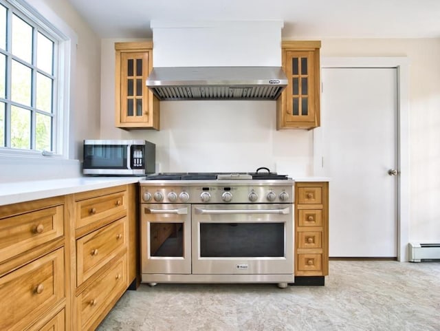 58 Leonard Dr, Tiverton, RI 02878 - kitchen with stainless steel appliances, wall chimney range hood, light countertops, and brown cabinets