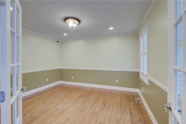 34 Ledgefield Rd, Scituate, RI 02857 - spare room with french doors, wood finished floors, crown molding, baseboards, and recessed lighting