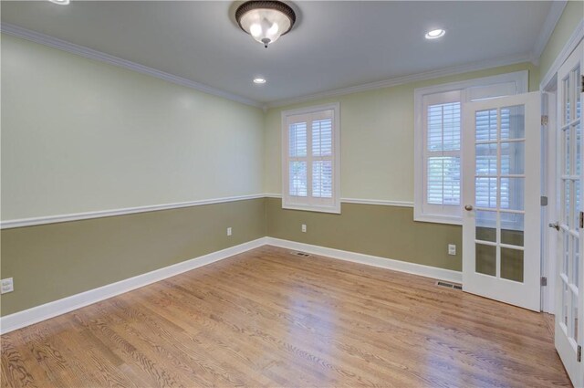 34 Ledgefield Rd, Scituate, RI 02857 - spare room featuring crown molding, wood finished floors, french doors, baseboards, and recessed lighting