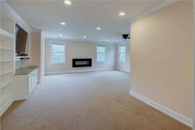 34 Ledgefield Rd, Scituate, RI 02857 - unfurnished living room with ornamental molding, light colored carpet, recessed lighting, baseboards, and a ceiling fan