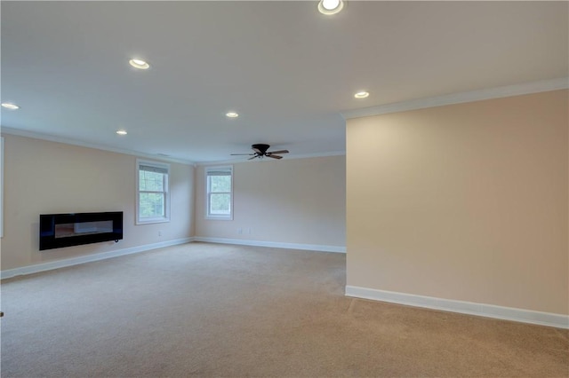 34 Ledgefield Rd, Scituate, RI 02857 - unfurnished living room featuring crown molding, light colored carpet, recessed lighting, baseboards, and a glass covered fireplace