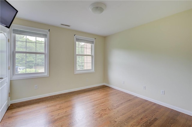 34 Ledgefield Rd, Scituate, RI 02857 - empty room featuring plenty of natural light, wood finished floors, and baseboards