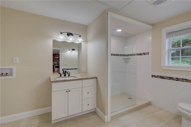 34 Ledgefield Rd, Scituate, RI 02857 - bathroom featuring walk in shower, vanity, tile patterned flooring, toilet, and baseboards