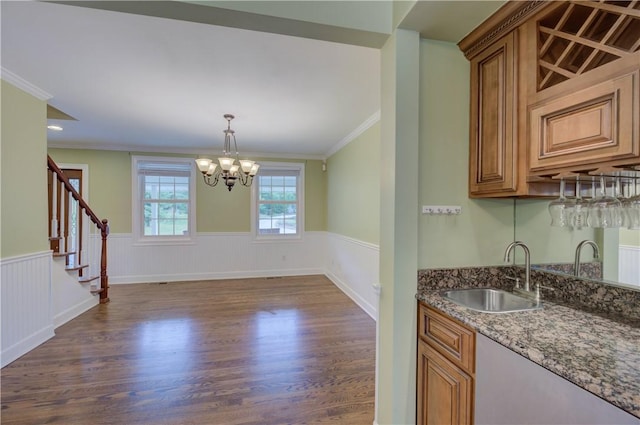 34 Ledgefield Rd, Scituate, RI 02857 - kitchen with a sink, dark wood-style flooring, wainscoting, crown molding, and a chandelier