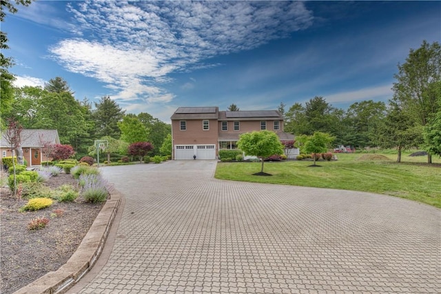 34 Ledgefield Rd, Scituate, RI 02857 - view of front of house with decorative driveway, a front yard, and a garage